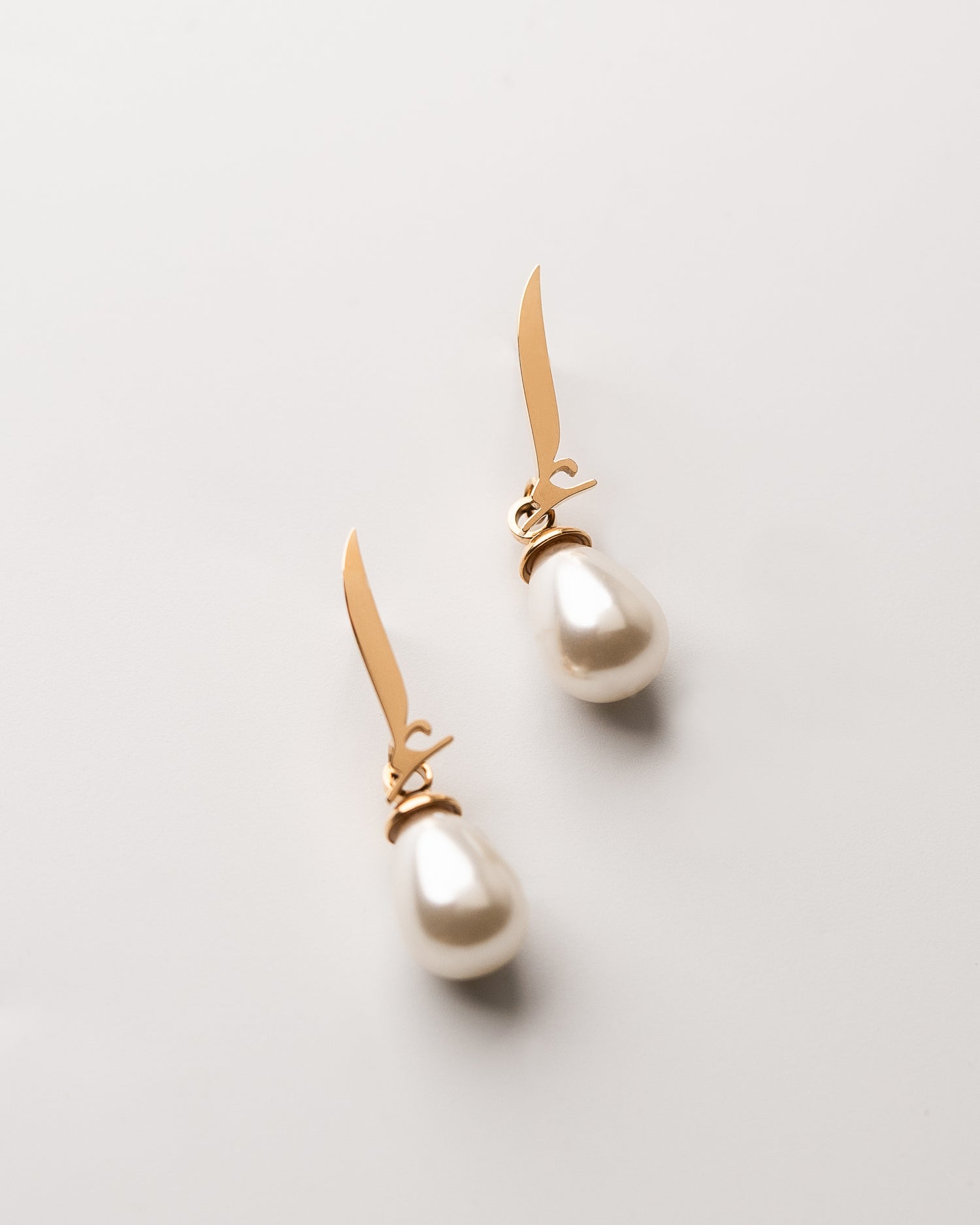 Calligraphed Letter Earrings إ